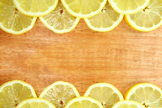 Lemon Fruit Slices Sitting on a Wooden Surface