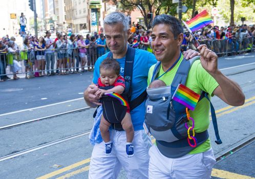 SAN FRANCISCO -  JUNE 30 : An unidentified Gay couple participates at the annual San Francisco Gay pride parade on June 30 2013