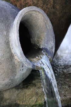 Fountain in the form of the old turned jug 