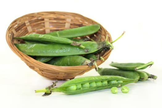 fresh green peas on a white background