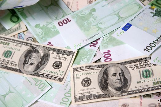 100 Euros and 100 Dollars money stack 