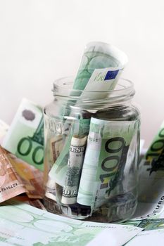 Euro banknotes in glass bank