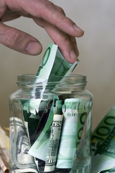 Bank with money and man's hand
