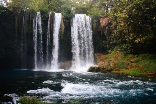 duden waterfall in antalya turkey with tree and mountain view