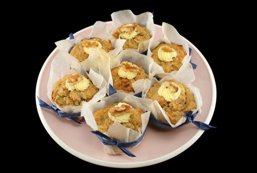 Homestyle fresh baked fruit muffins with cream cheese and walnuts.