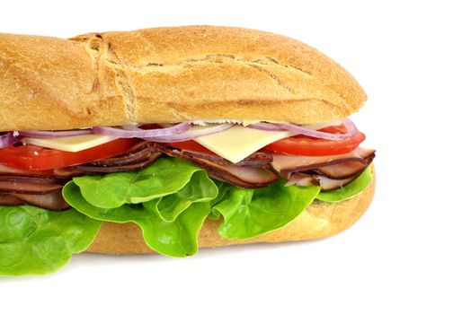 Giant ham, tomato, lettuce, cheese and onion sub ready to serve.