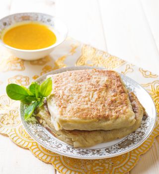 Mutabbaq or murtabak is a popular middle east stuffed bread