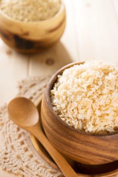 India cooked organic basmati brown rice in wooden bowl.