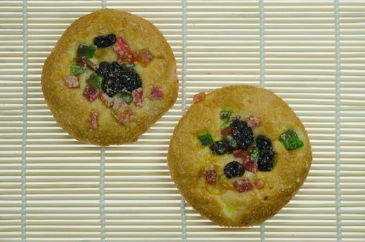 top view two sweet bread with raisin and  dried fruits  on wooden background