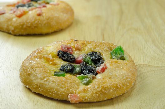 close up  bread with raisin and  dried fruits  on wooden board 