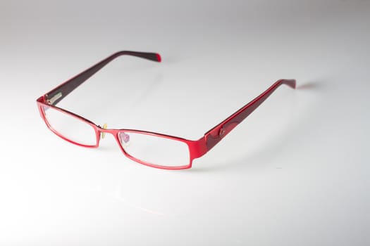 Red spectacles on isolated white background