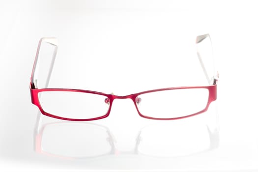Red spectacles on isolated white background