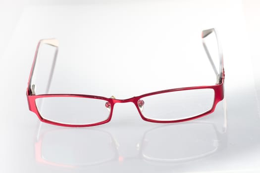 Red spectacles on isolated white background