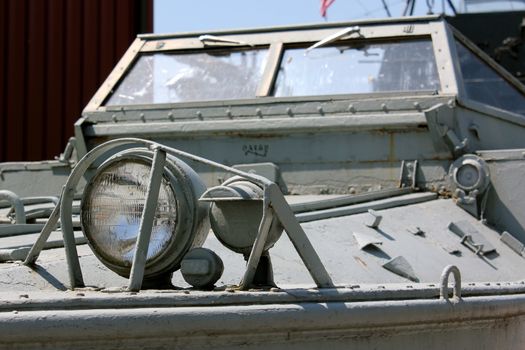 Close-up of the front of an aged and decaying DUKW, commonly known as Duck, military amphibious truck used during World War II on display at the Buffalo and Erie County Naval and Military Park, Buffalo, NY, USA