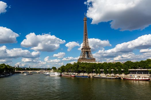Eiffel Tower and Seine River with White Clouds in Background, Paris, France