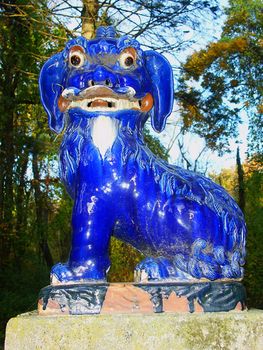 Monticello, IL United States - November 02, 2007: One of many statues in the Fu Dog Garden of the Robert Allerton Park near Monticello, Illinois.  This garden was designed in 1932 and includes 22 Chinese Fu Dog Statues.