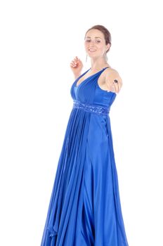 Portrait of a beautiful young woman in blue dress, holds out his hand on white background