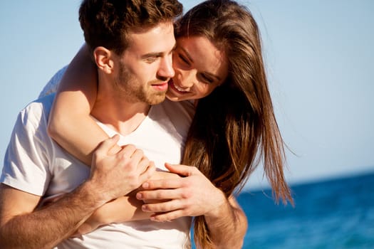 young happy couple in summer holiday vacation summertime beach