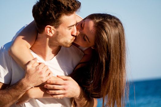 young happy couple in summer holiday vacation summertime beach