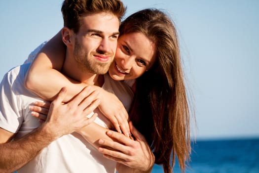 young happy couple in summer holiday vacation summertime beach