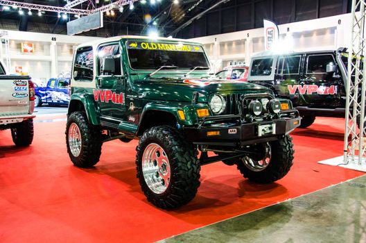 BANGKOK - JUNE 20 : Jeep Sahara Wrangler car on display at Bangkok International Auto Salon 2013 Exciting Modified Car Show on June 20, 2013 in Bangkok, Thailand.