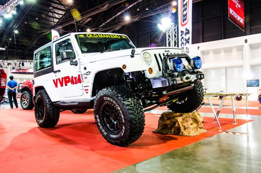 BANGKOK - JUNE 20 : Jeep Sahara Wrangler car on display at Bangkok International Auto Salon 2013 Exciting Modified Car Show on June 20, 2013 in Bangkok, Thailand.