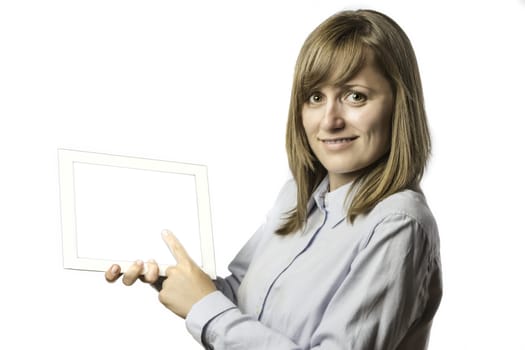 Young pretty woman shows something on her tablet computer, isolated on white background