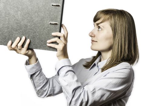 Young woman at the office takes a file folder, isolated on white background