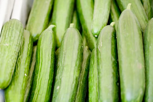 fresh green cucumber collection outdoor on market macro