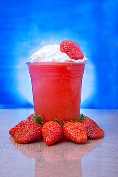 Beautiful strawberry drink with fresh fruit and whipped cream with artistic composition.