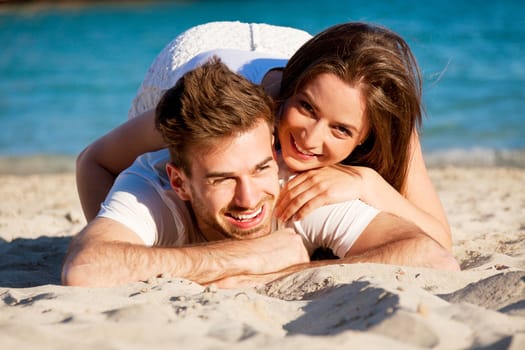 young happy couple in summer holiday vacation summertime beach