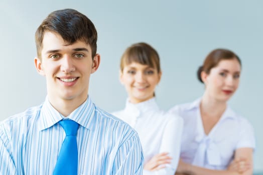 successful businessmen, a portrait of a businessman behind him are his colleagues