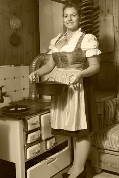 Young peasant woman on the mountain when cooking food in black / white