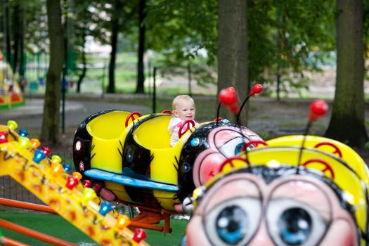 child in park of attractions