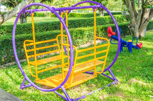 A colorful playground in a park.