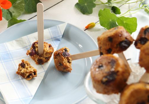 Cute sweet muesli dessert baked in the shape of popsicles ready to serve.