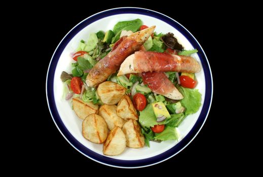 Chicken tenderloins wrapped in prosciutto with oven roasted chat potatoes and a garden salad.