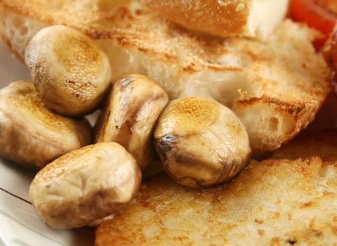 Button mushrooms with toast and a hash brown.