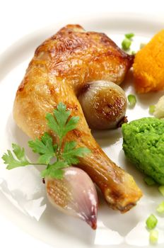 Roasted quarter of chicken with a pea, potato and butternut mash.