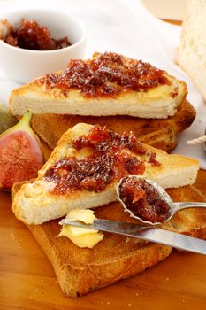 Rustic homemade fig jam sandwiches on toast ready to serve.