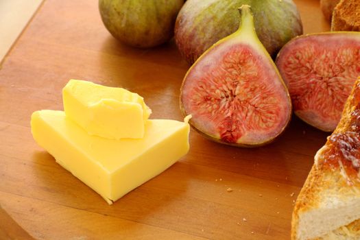 Butter stack with freshly sliced figs ready for sandwiches.