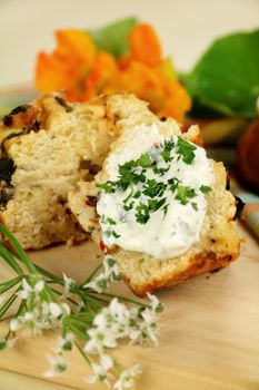 Fresh baked savory muffins with herb spread ready to serve.