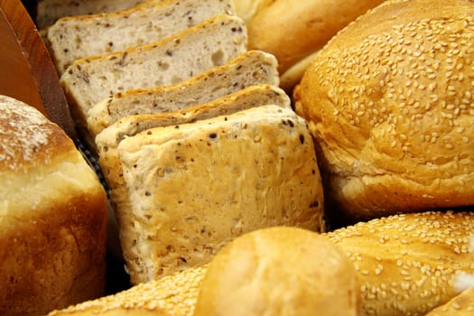 Selection of different types of rolls, loaves and bread.