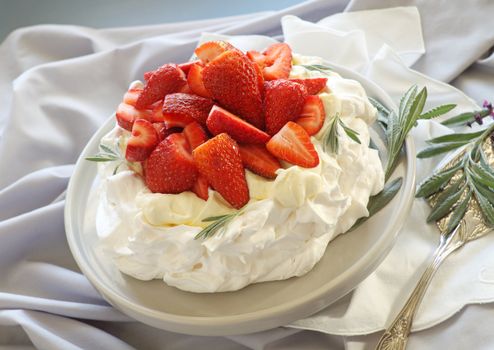 Delicious traditional Australian strawberry pavlova made from meringue and cream.