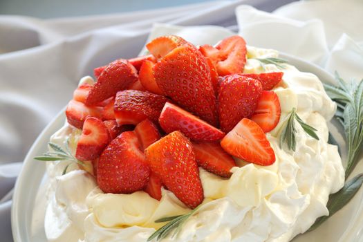 Delicious traditional Australian strawberry pavlova made from meringue and cream.