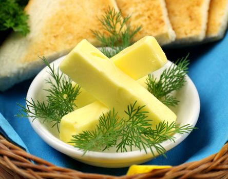 Tray of butter sticks with Italian parsley ready to serve.