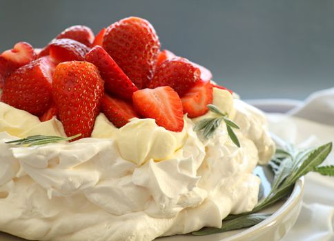 Delicious traditional Australian strawberry pavlova made from meringue and cream.