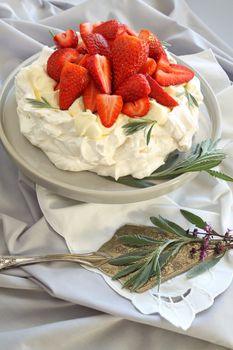 Delicious traditional Australian strawberry pavlova made from meringue and cream.