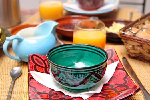 An empty plate on the table with food background
