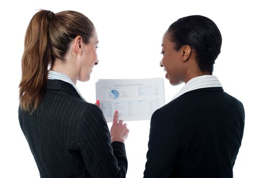 Female executives analyzing documents